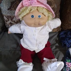Cabbage Patch doll, just Like New, (even hair), over a dozen articles of clothes